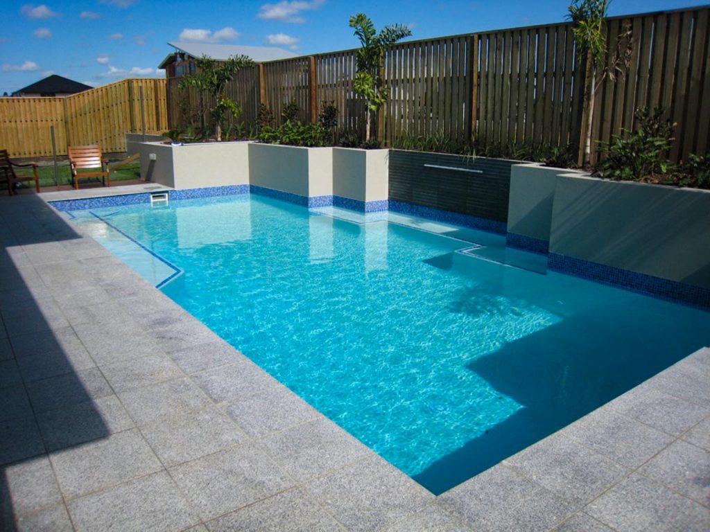 Tiled swimming pool and surrounds