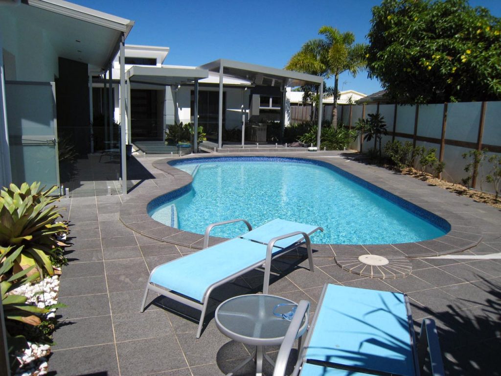 Tiled swimming pool and surrounds