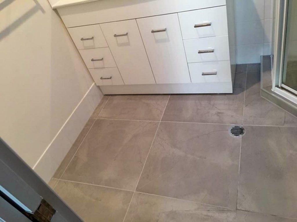 Large tiles on bathroom floor